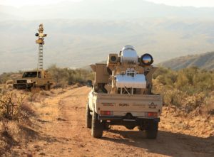 Two surveillance towers on pick up trucks